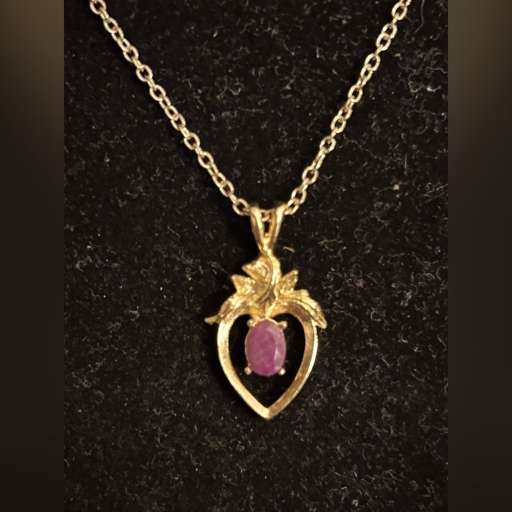 Vintage gold-tone heart pendant necklace with amethyst color stone.